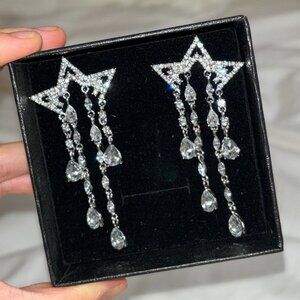 brand new never worn sterling silver dangling drop star earrings